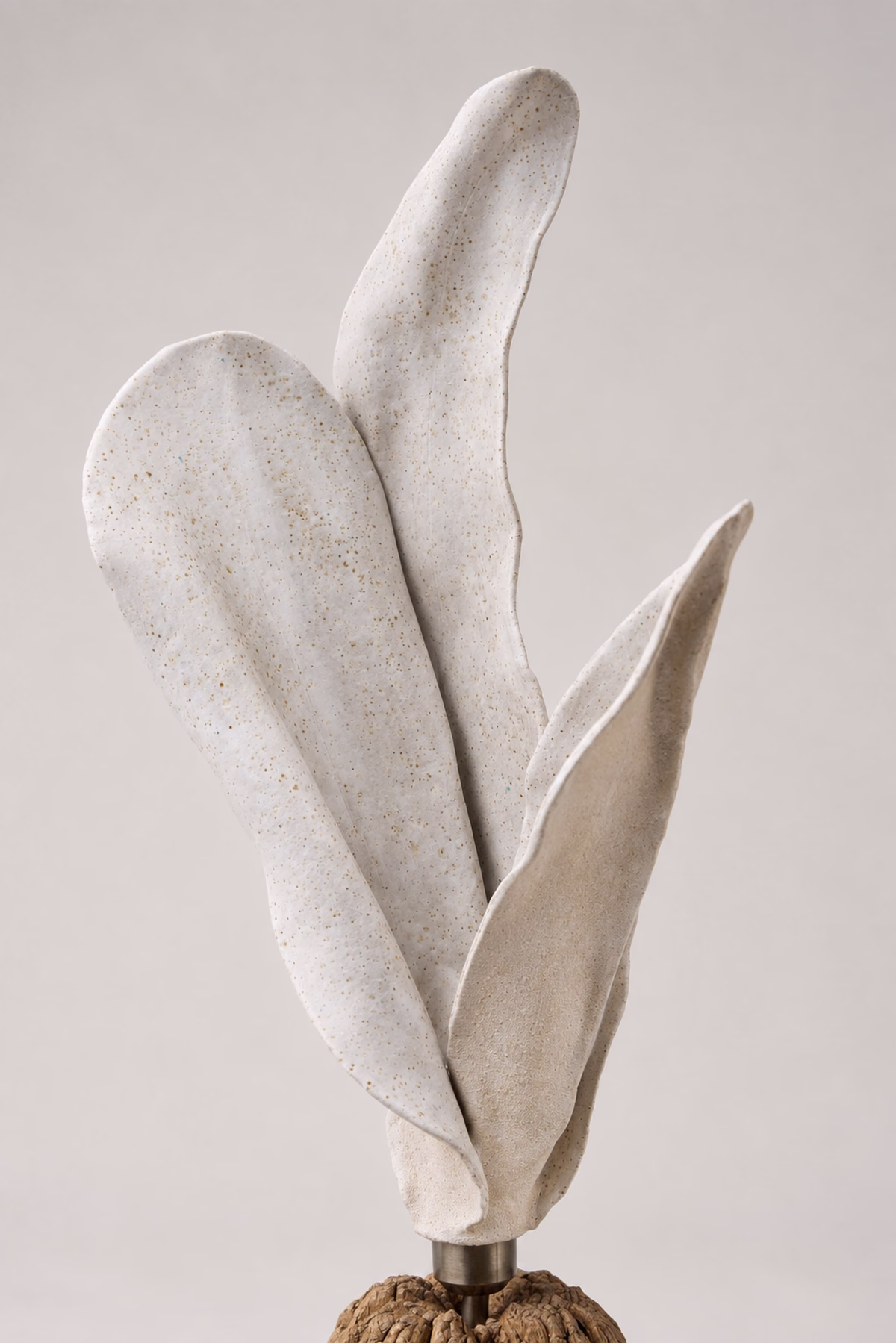 Handcrafted sculptural luminary with warm light texture