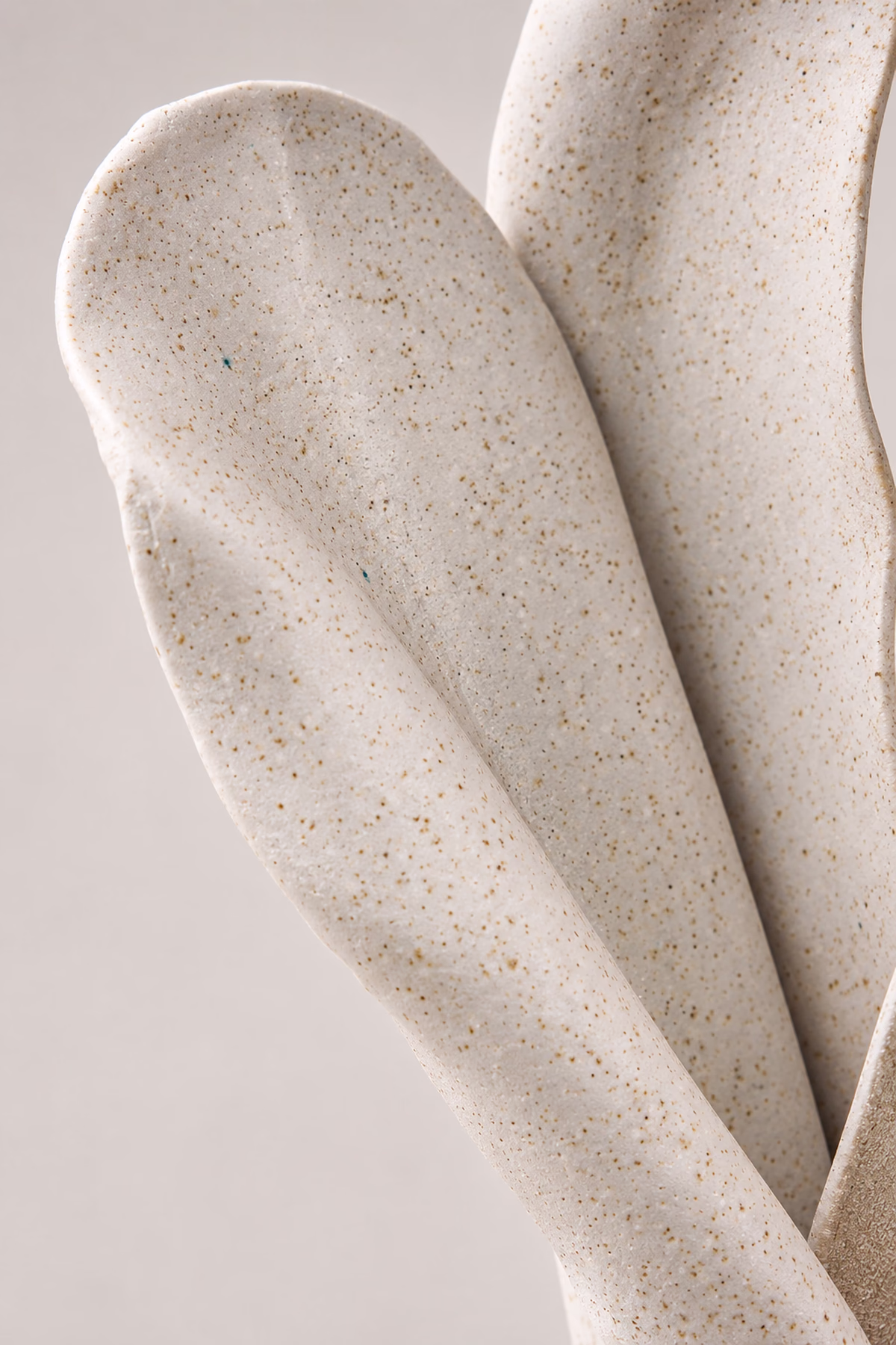 Handcrafted sculptural luminary with warm light texture