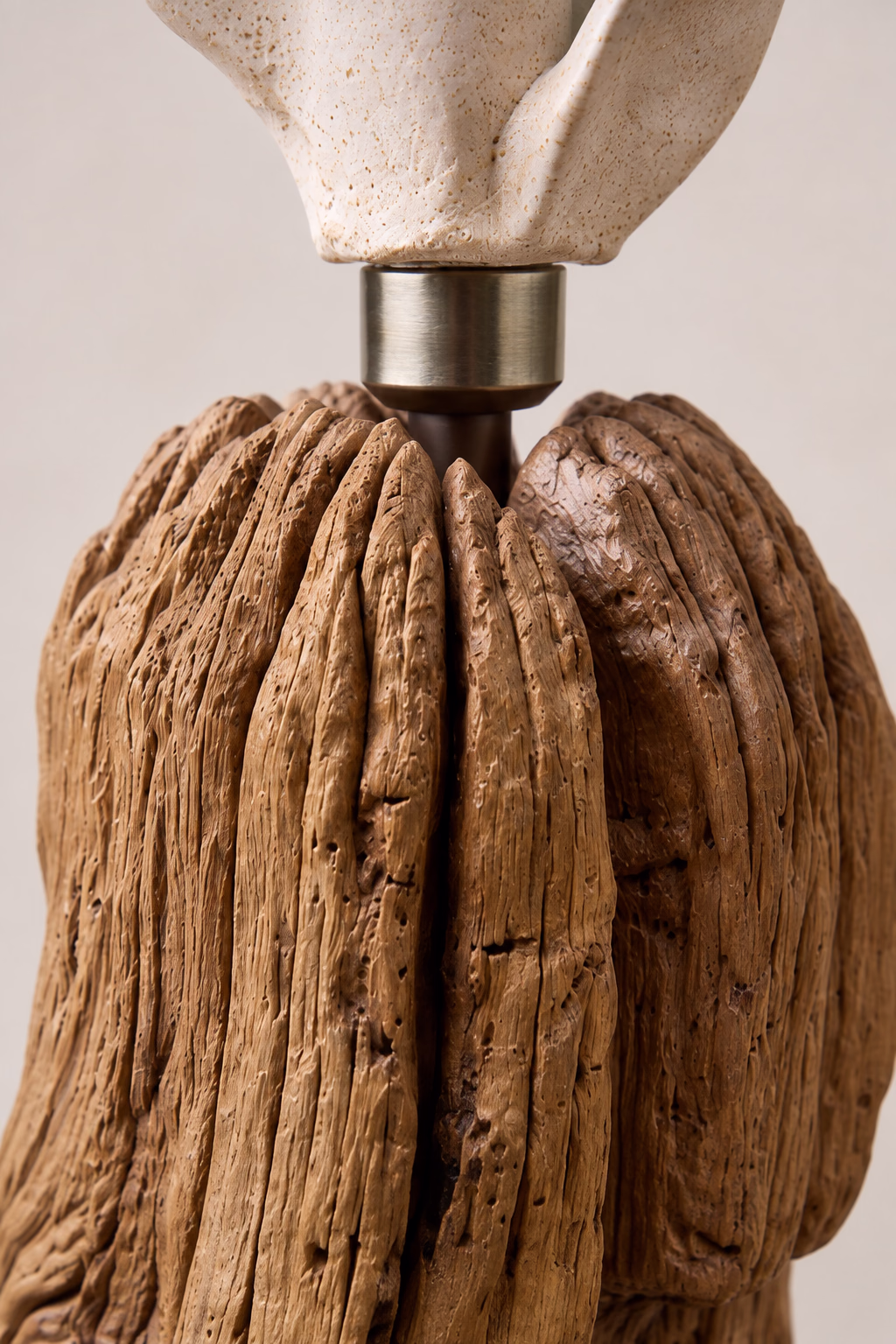 Handcrafted sculptural luminary with warm light texture