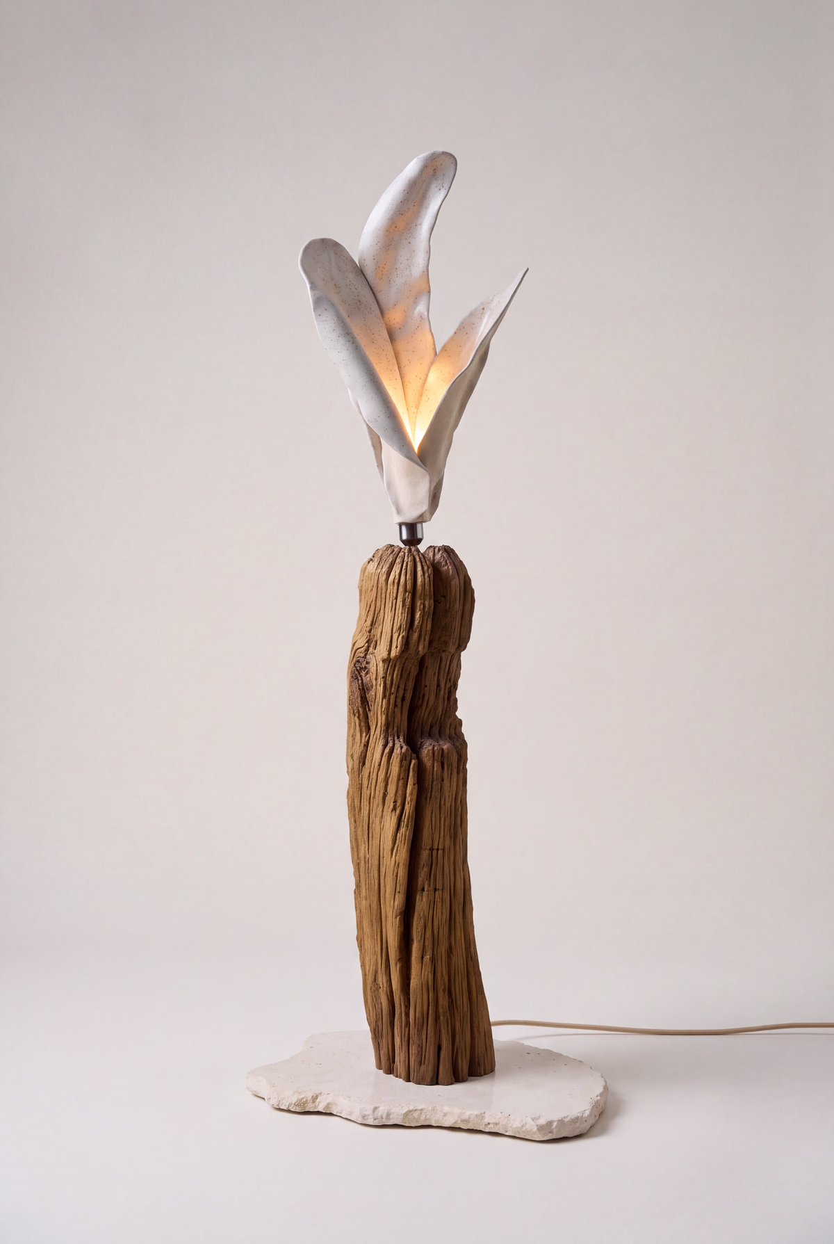 Handcrafted sculptural luminary with warm light texture